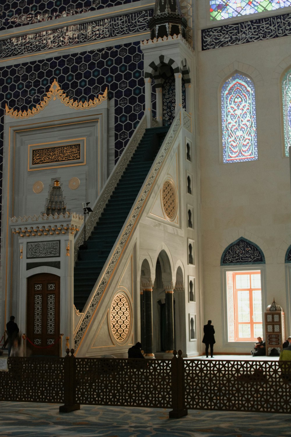 a church with a steeple and stained glass windows