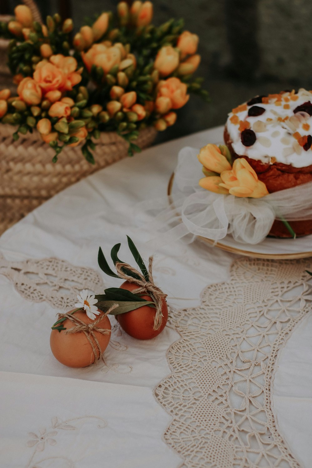 a table topped with a cake and two eggs