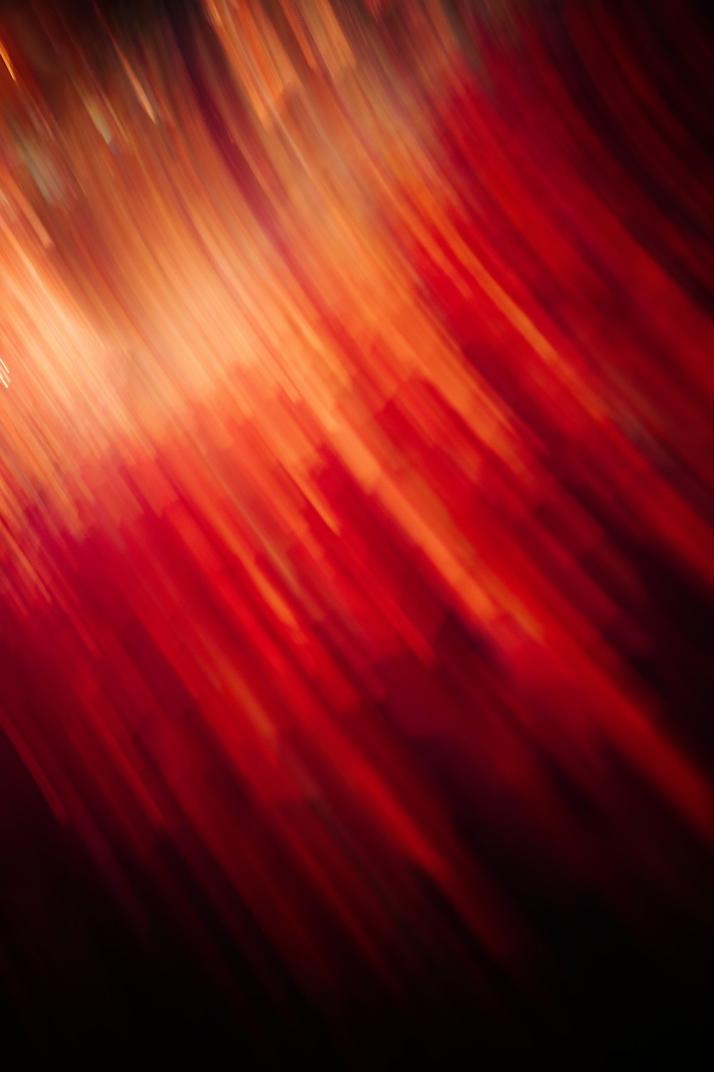 a blurry image of a red and yellow background