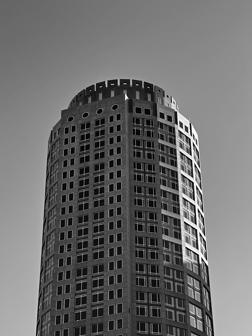 a black and white photo of a tall building