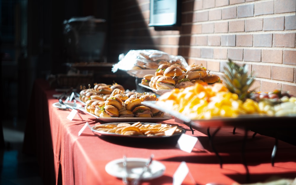 a buffet table with plates of food on it