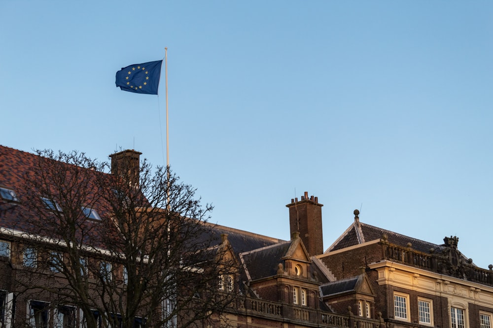 a european flag flying in front of a building