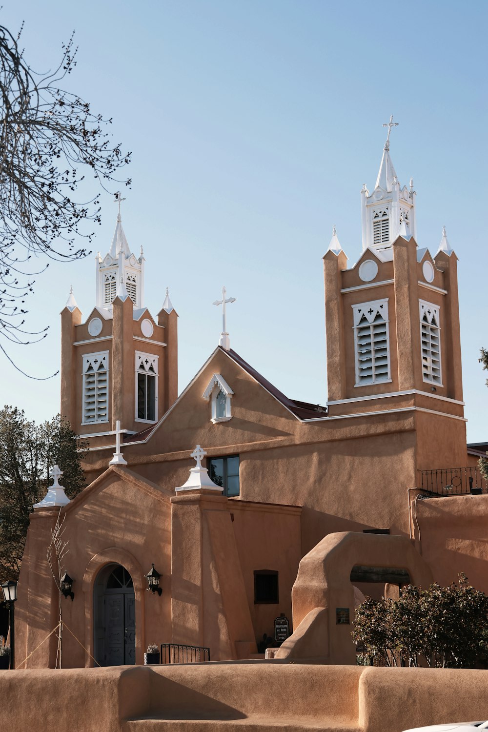 a church with two steeples and a bell tower