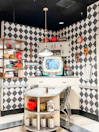 Charming kitchen area with vintage decor and modern appliances.