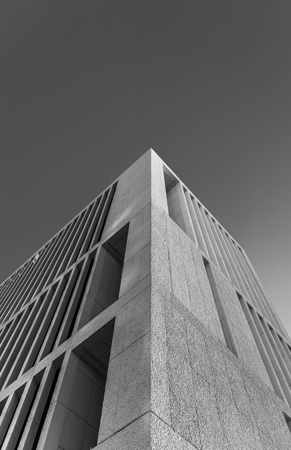 a black and white photo of a tall building