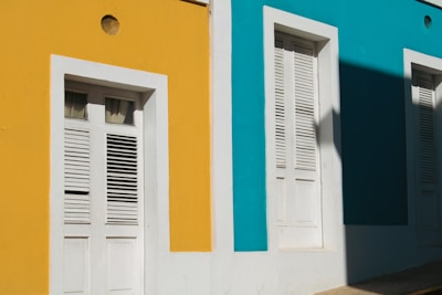 A freshly painted exterior wall with vibrant colors under natural sunlight.