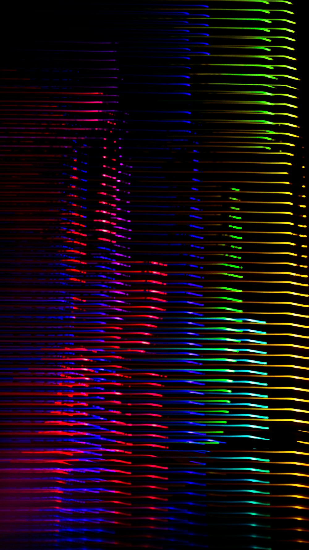 a multicolored image of a building in the dark