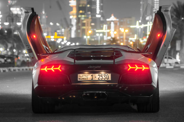 Side view of a sports car showcasing custom LED strip lighting along the doors.