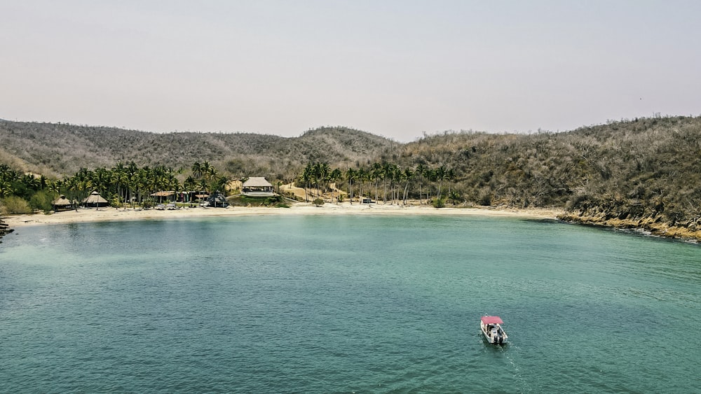 a small boat in a large body of water