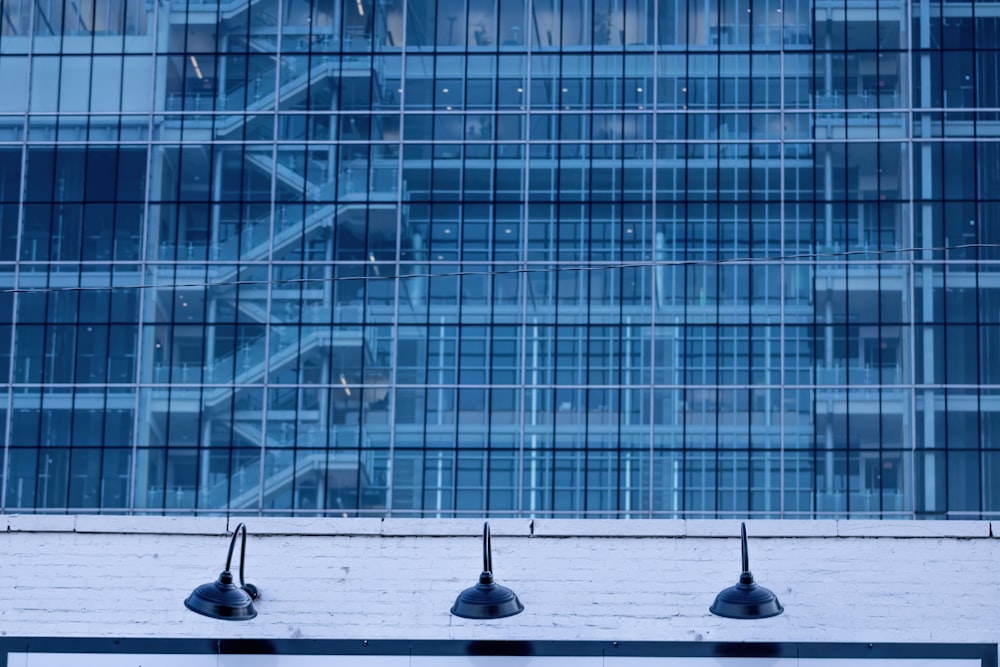 a bench sitting in front of a tall building