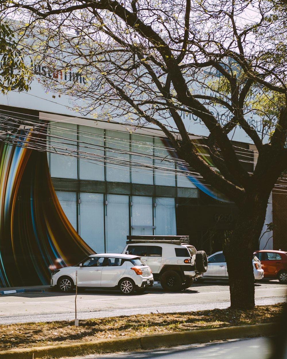 a building that has a bunch of cars parked in front of it