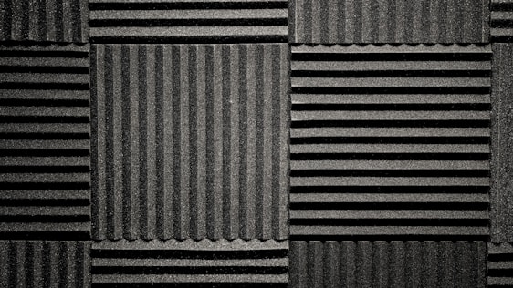 Modern acoustic panels being installed in a stylish office space.