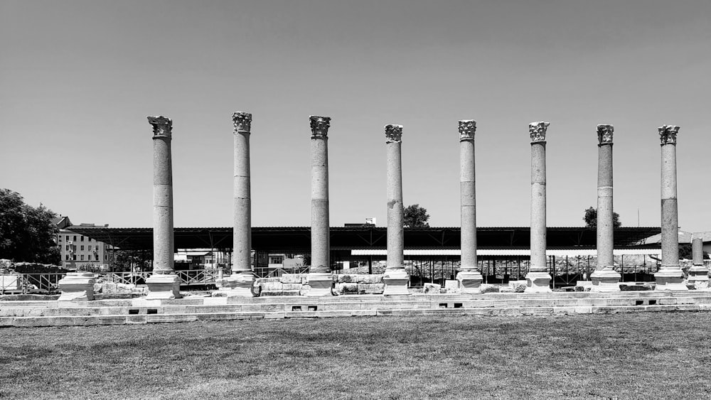 a black and white photo of a building with many columns