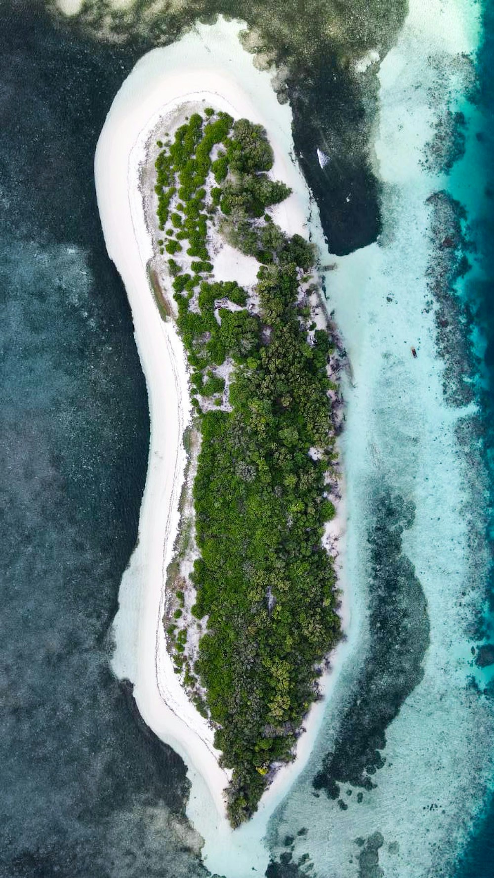 an aerial view of an island in the middle of the ocean