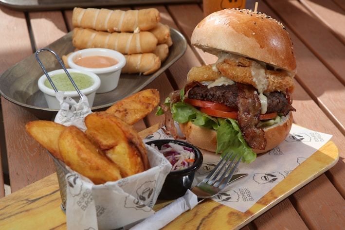 a hamburger and french fries on a table