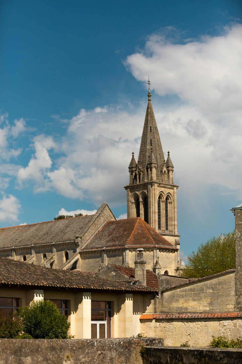 an old building with a steeple and a clock tower