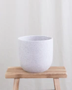 Minimalist meditation cushion with soft clay texture in muted earth tones