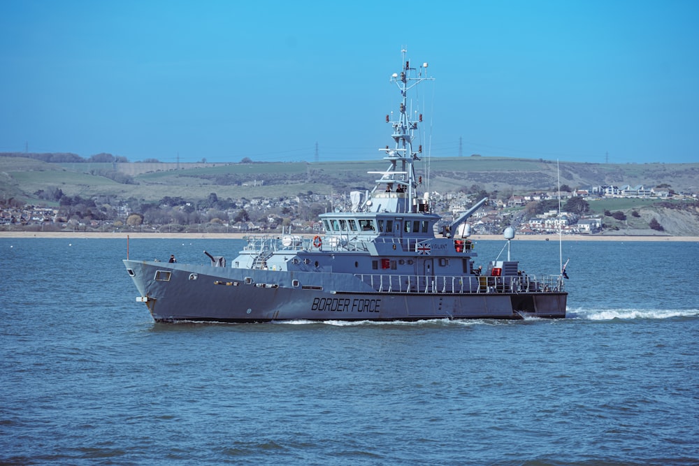 a large boat in the middle of a body of water