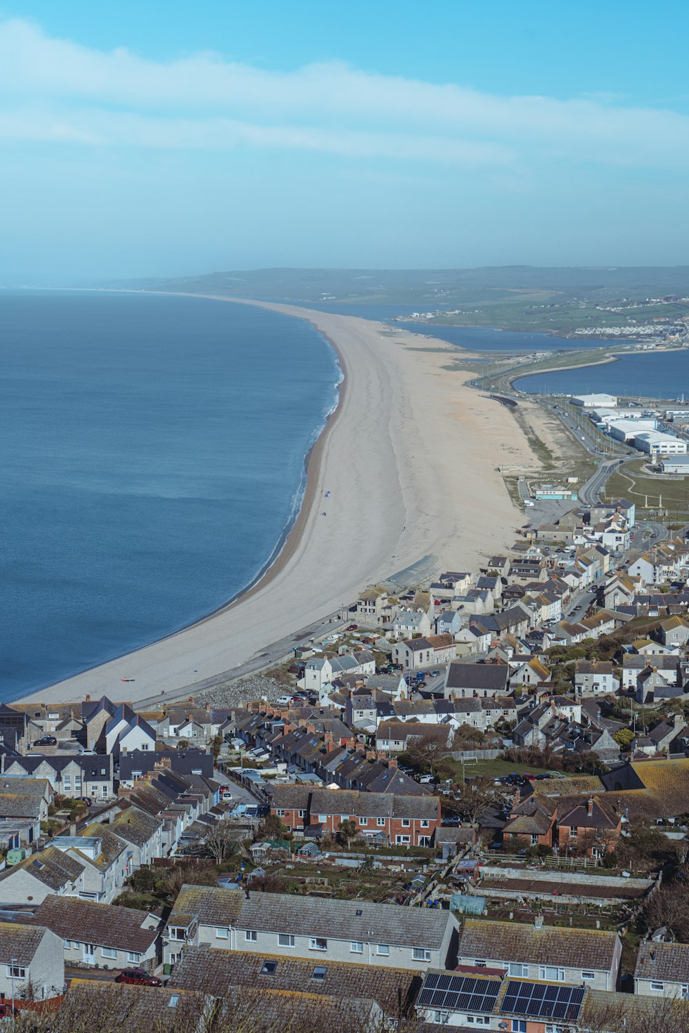 an aerial view of a beach and a city