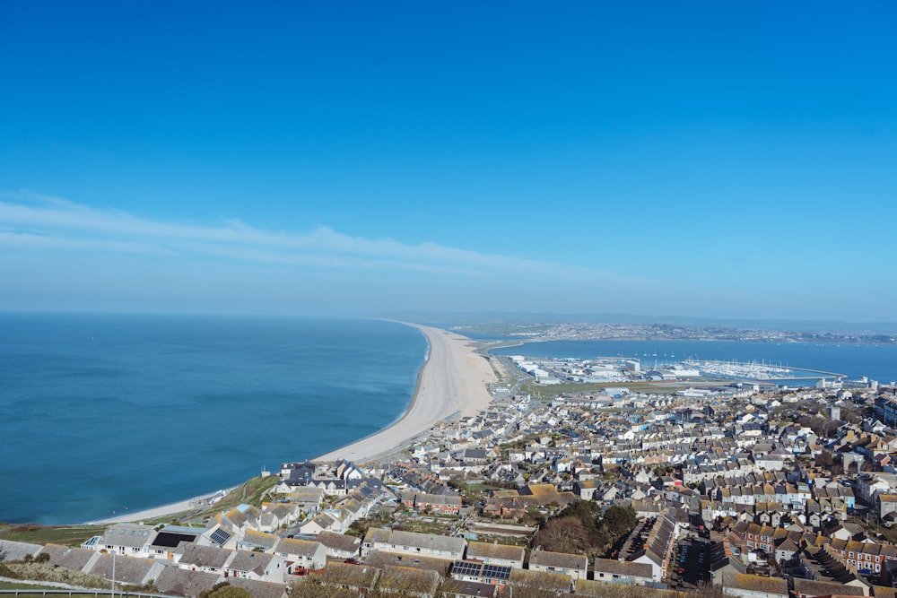 an aerial view of a city by the ocean