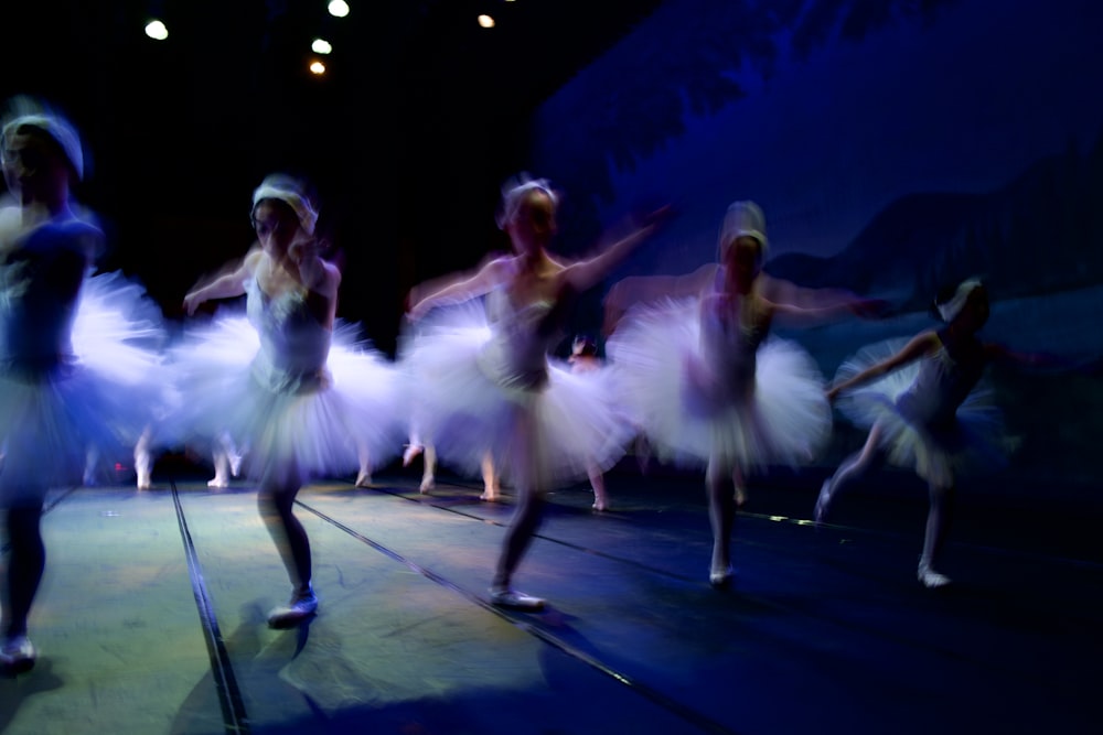 a group of people that are standing on a stage