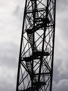 a very tall metal structure with a sky in the background