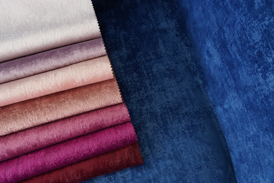 Close-up of soft, fluffy fabric swatches in lilac, blue, merle, platinum, and isabella shades.