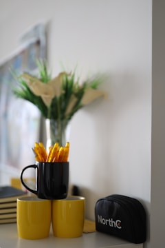 A collection of corporate gifts including branded mugs, pens, and notebooks arranged neatly.