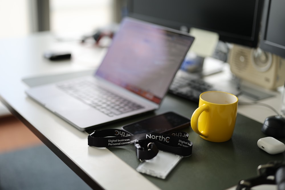 a laptop computer sitting on top of a desk