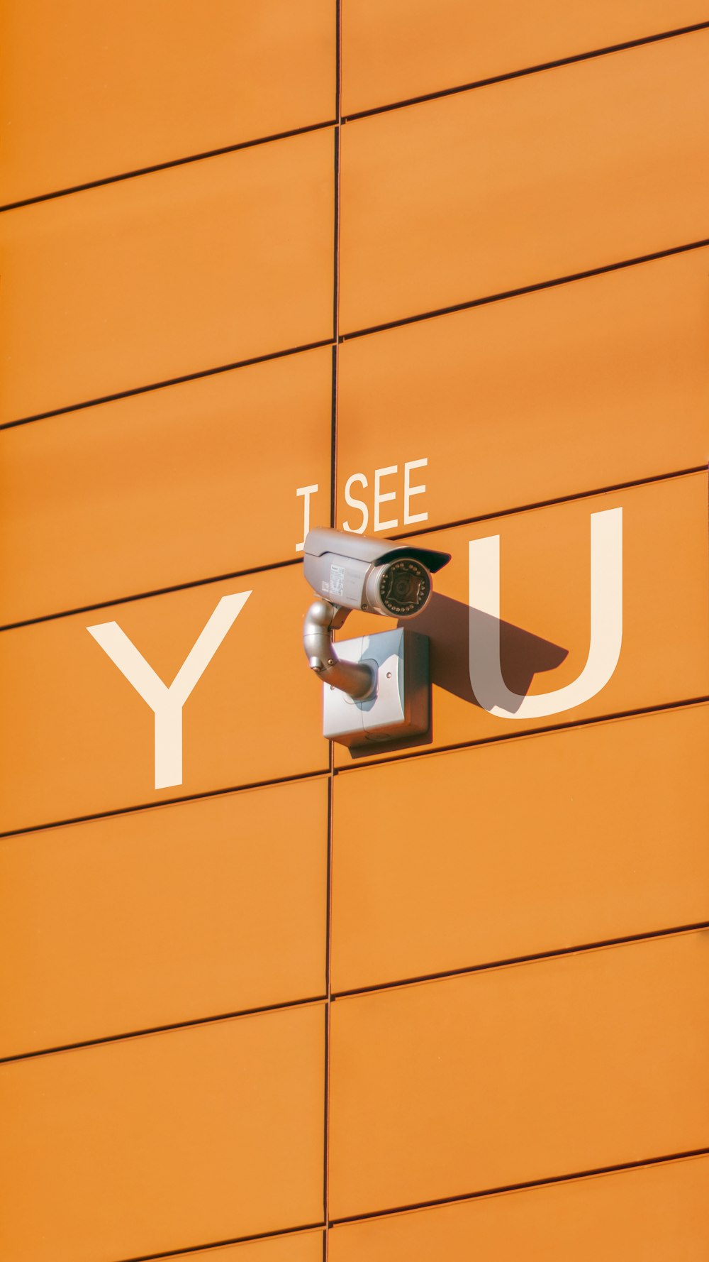 a security camera mounted to the side of a building