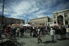 a large group of people standing in a plaza