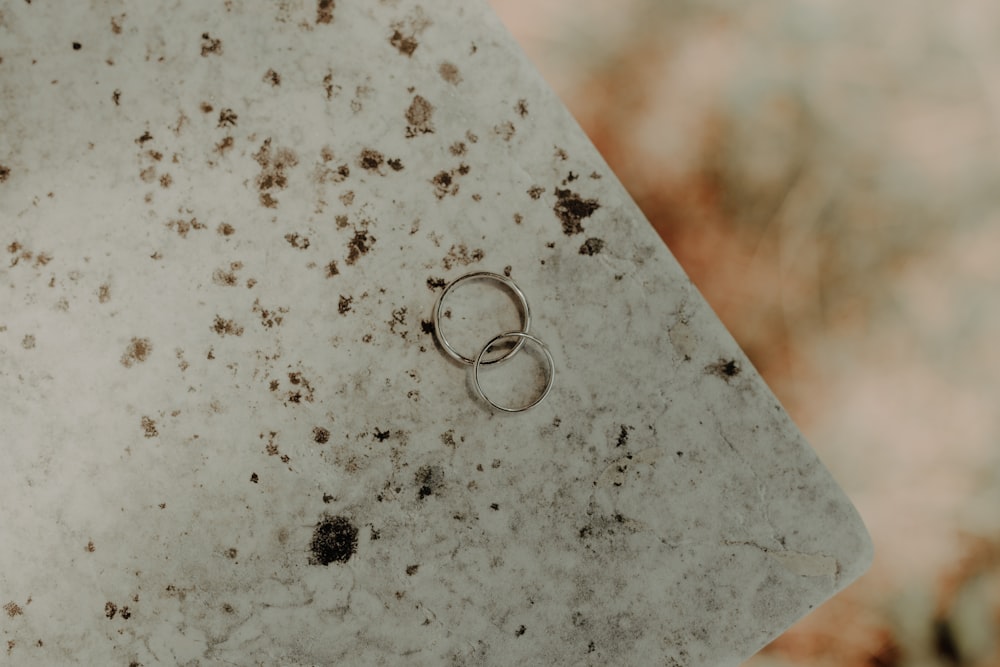 a couple of rings sitting on top of a table