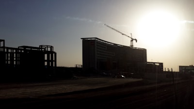 Bright sunrise over a construction site symbolizing new beginnings