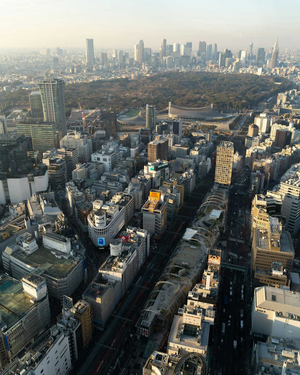 an aerial view of a city with lots of tall buildings