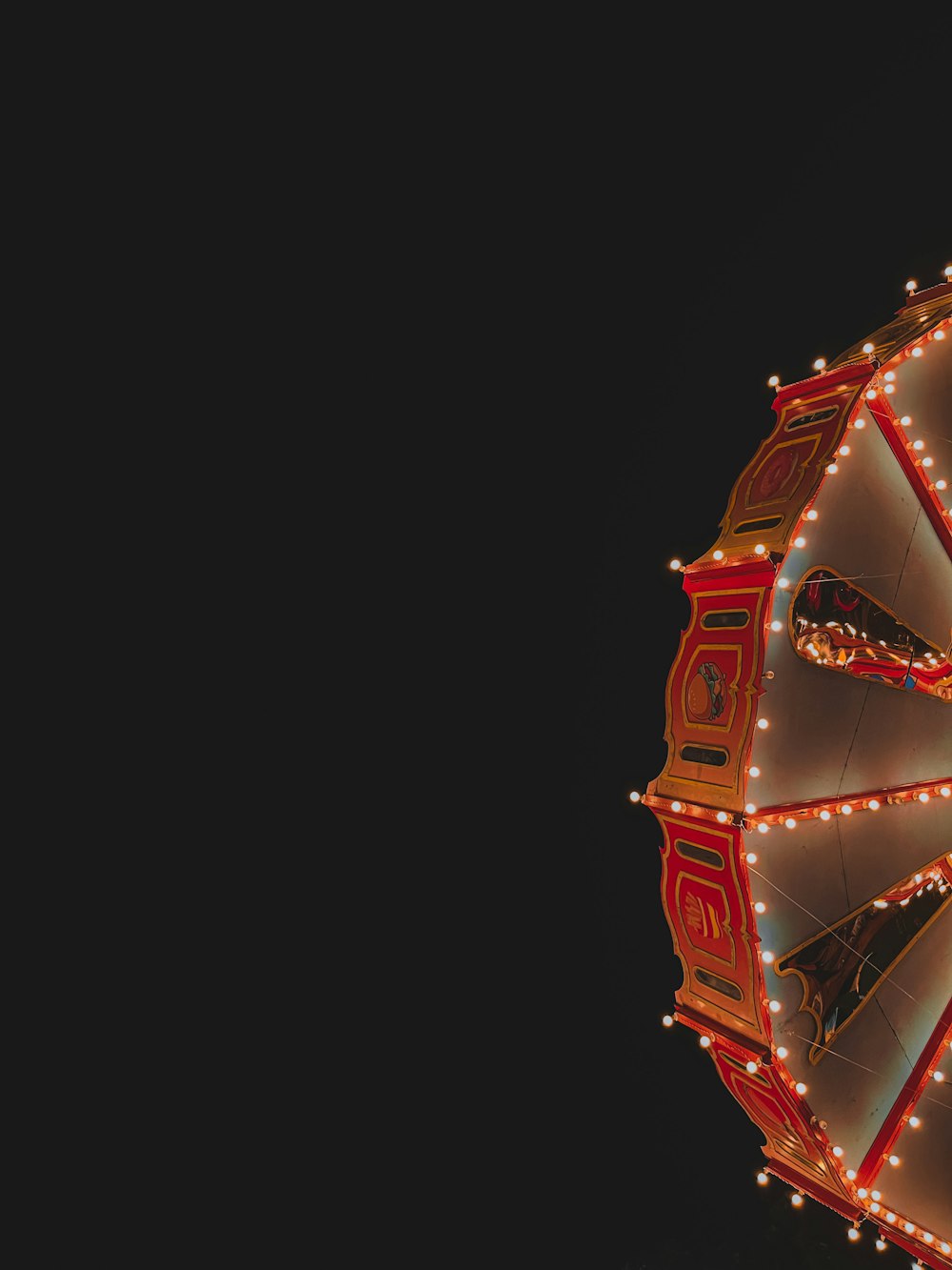 a ferris wheel lit up with christmas lights