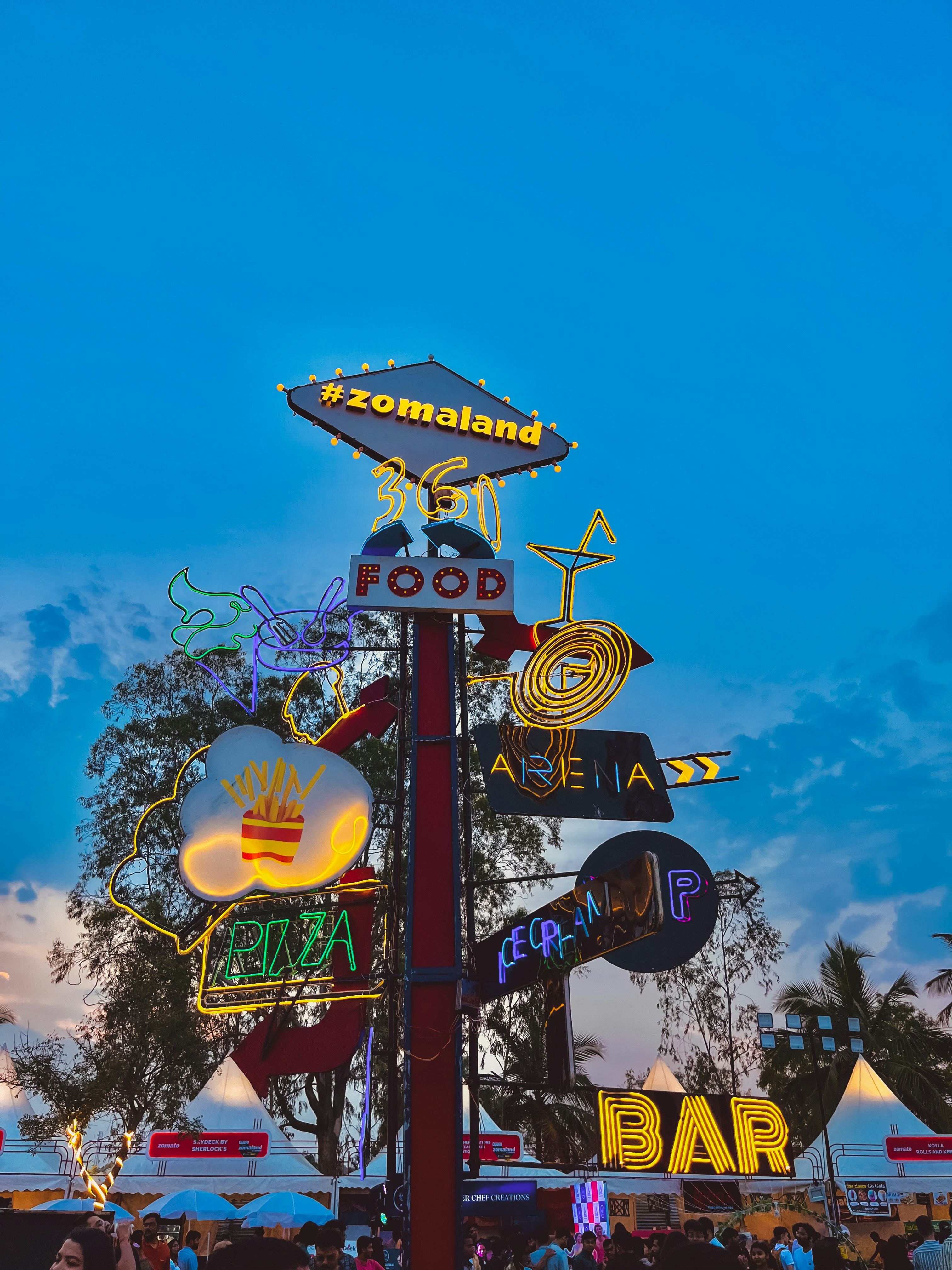 a street sign that has a lot of signs on it