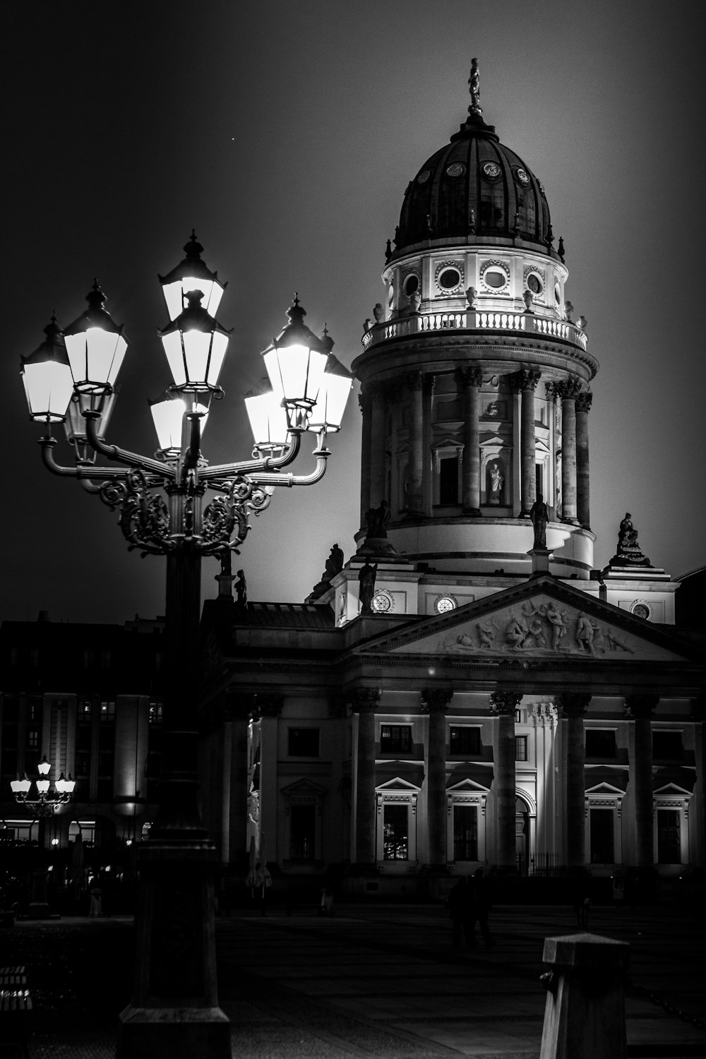 a black and white photo of a building at night