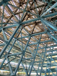 a large metal structure with a clock on it's side