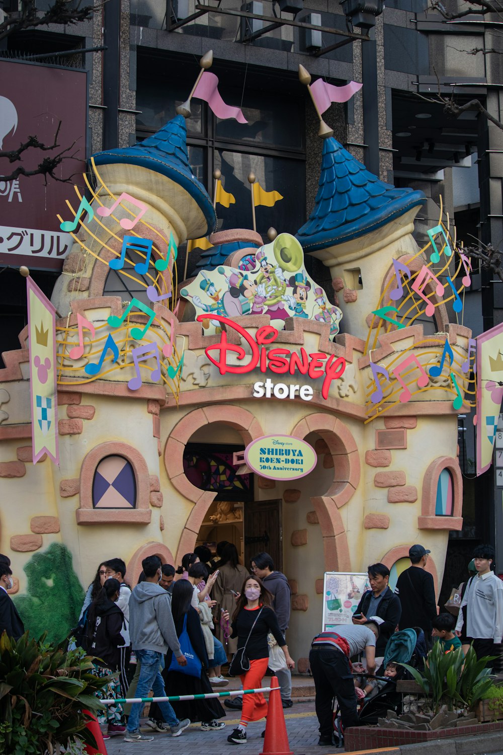 a group of people standing in front of a building