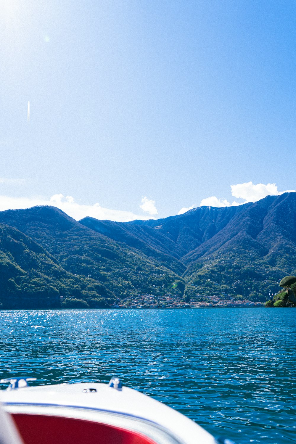 a view of a body of water with mountains in the background