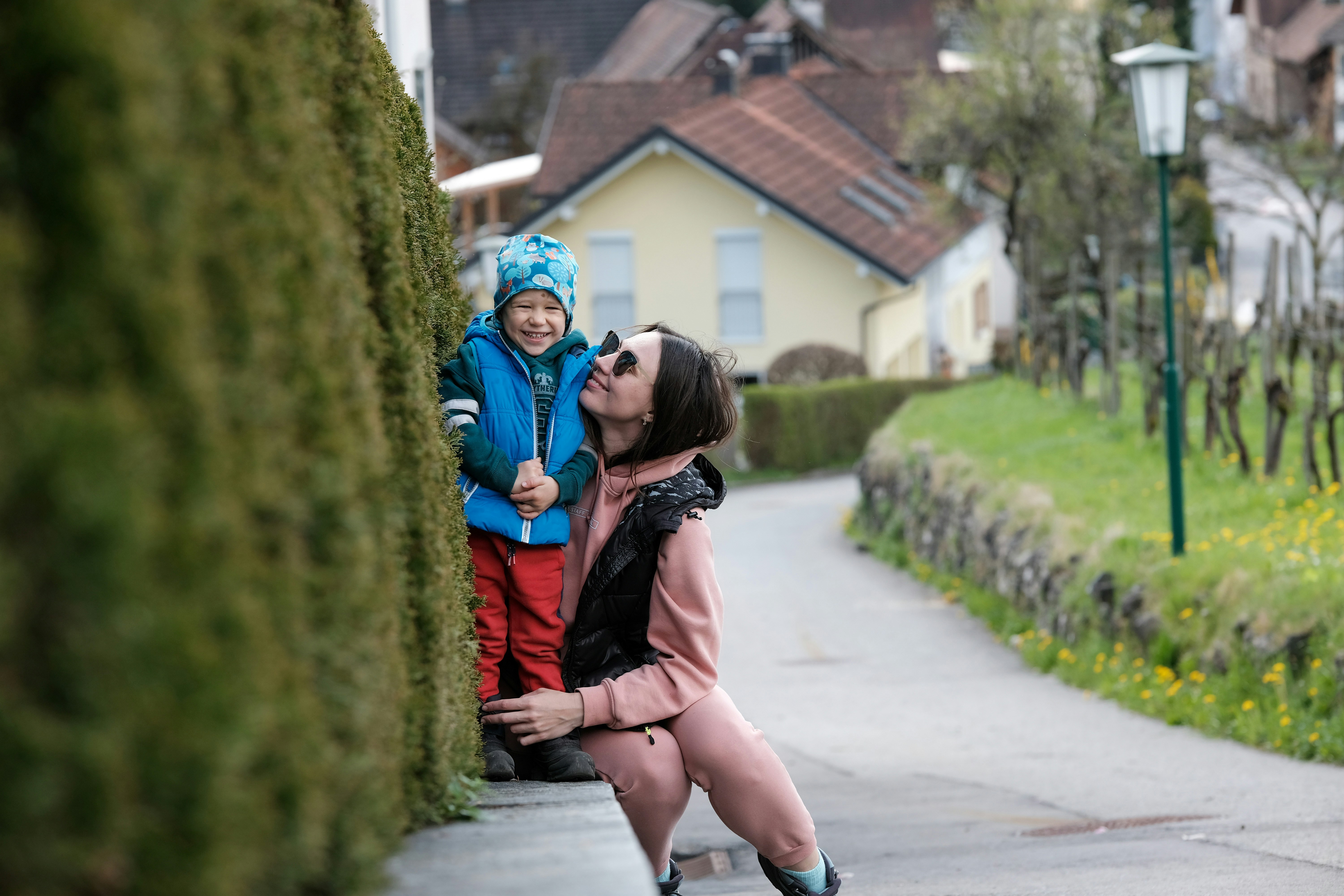 Mother kissing child