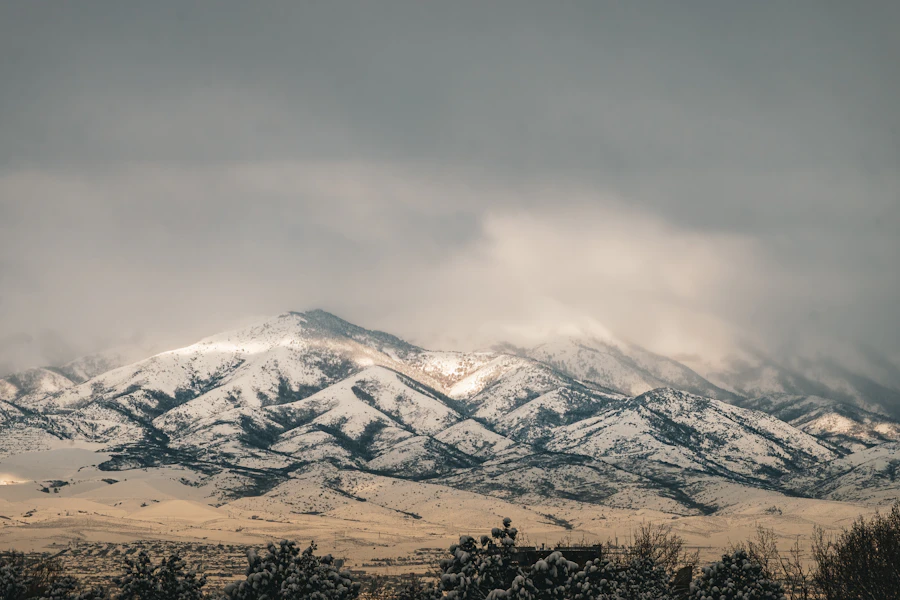 Snow-covered mountain range under a cloudy sky, a scenic backdrop for meeting singles from free LDS dating sites