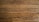 Wooden floor planks with visible grain and texture, featuring some scratches and imperfections.
