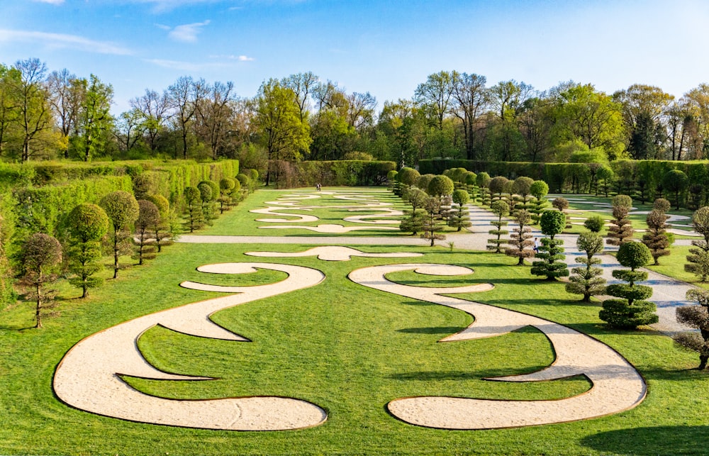 a large garden with a path in the middle of it