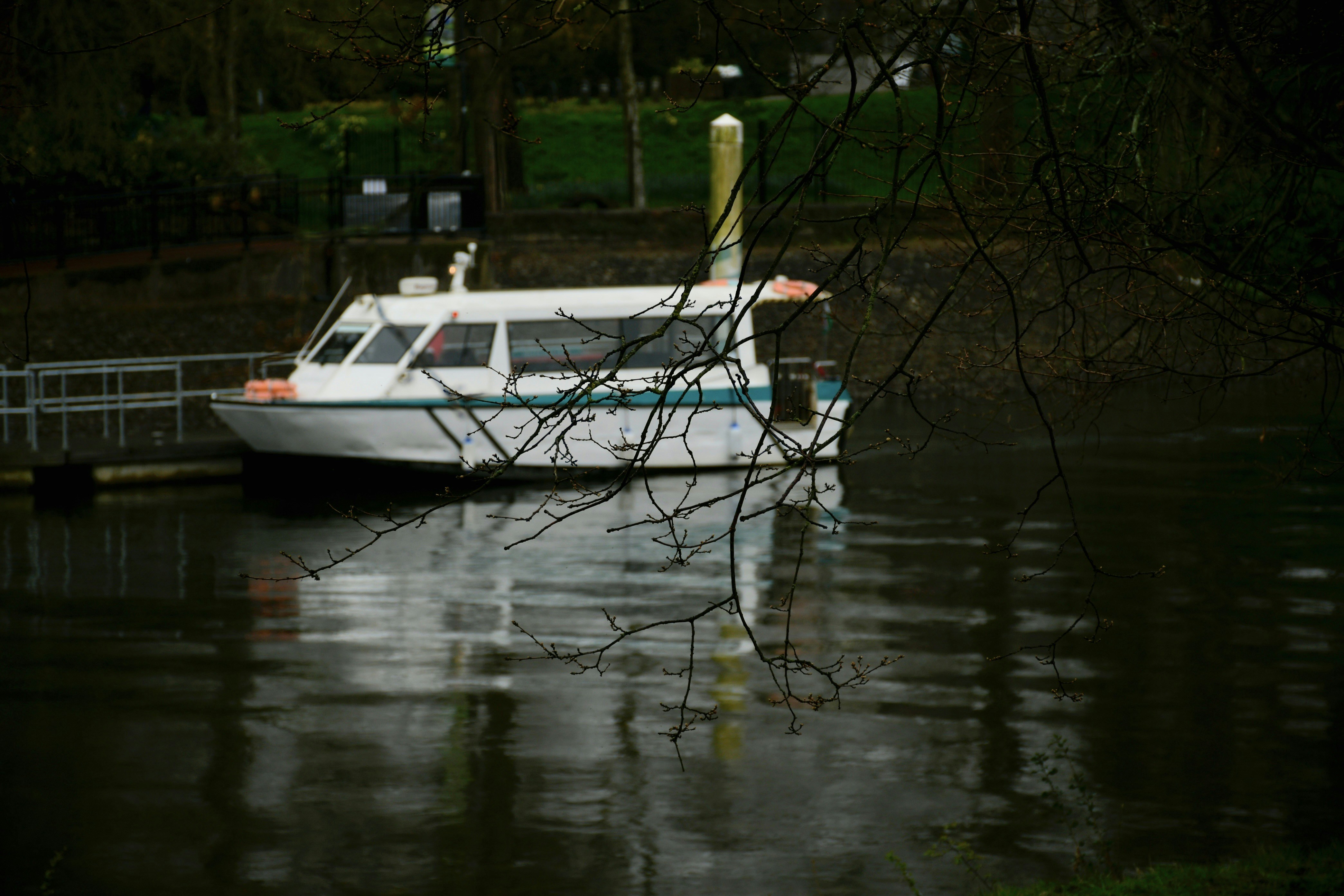 a white boat sitting on top of a body of water 풍경 사진