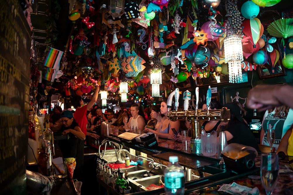 a group of people sitting at a bar