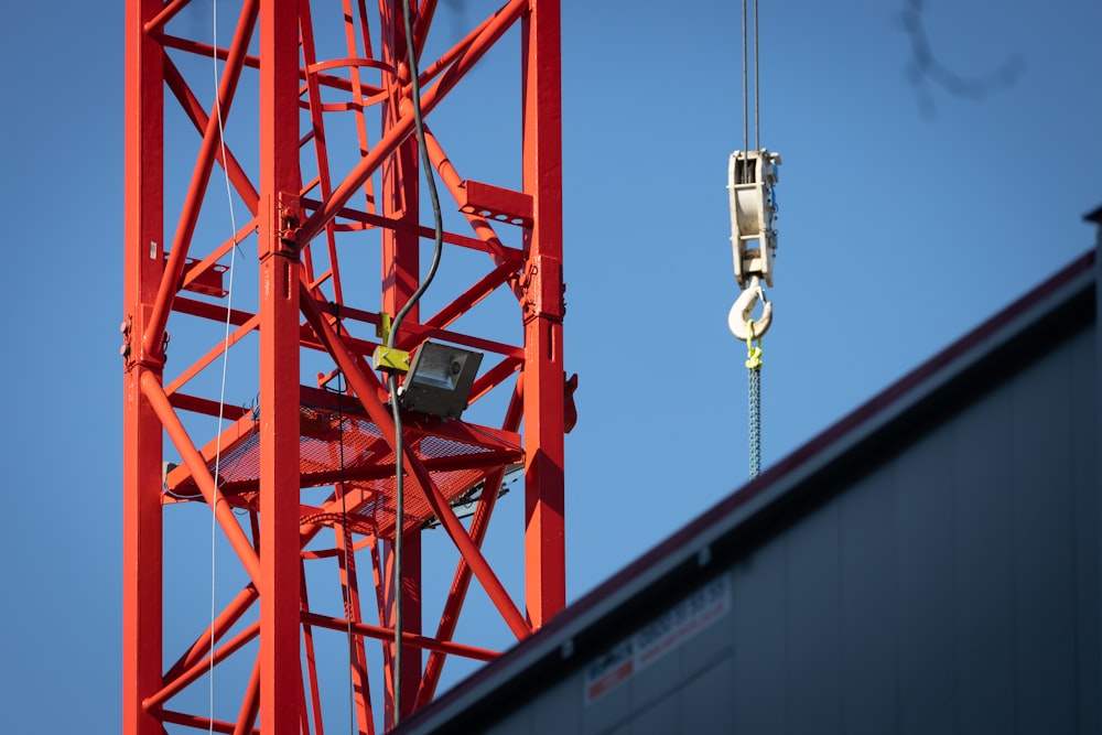 a crane that is hanging from the side of a building