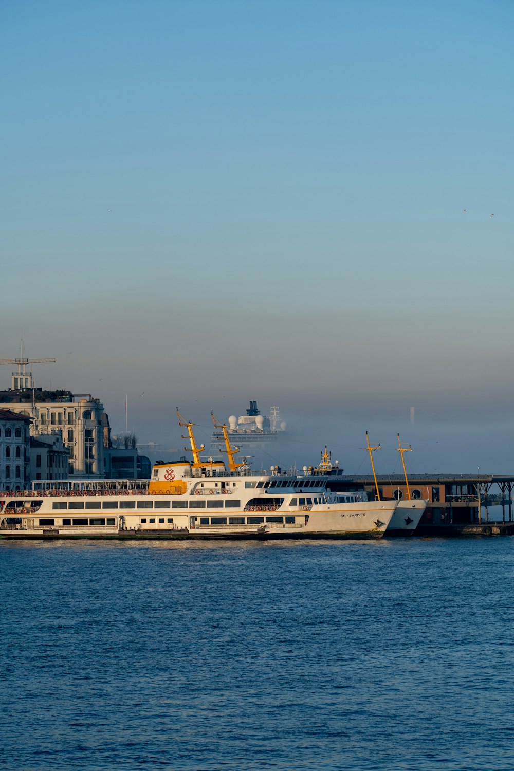 a large white boat in a body of water