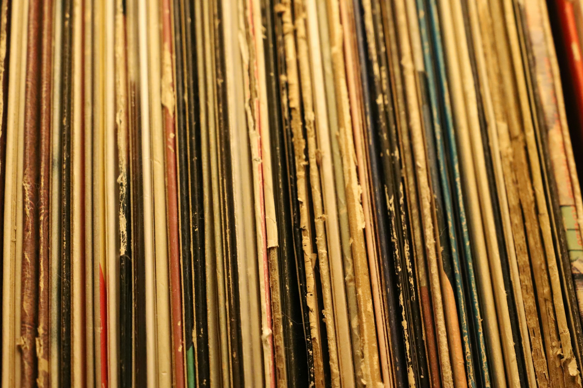 a collection of old records are stacked on top of each other