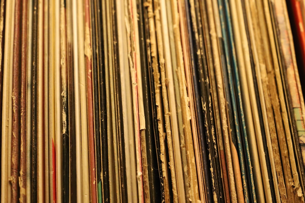 a collection of old records are stacked on top of each other